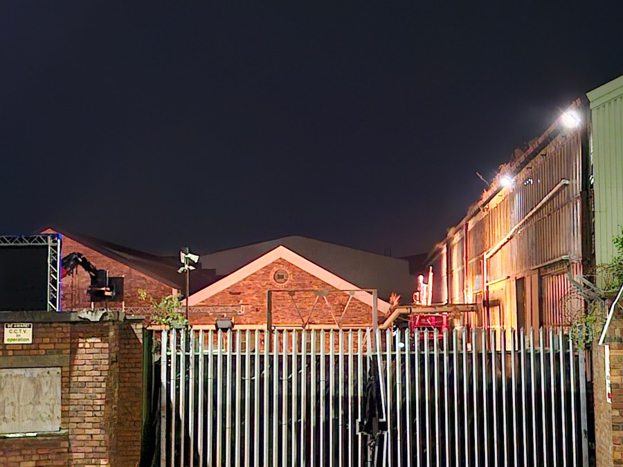 An industrial building, red brick, railing