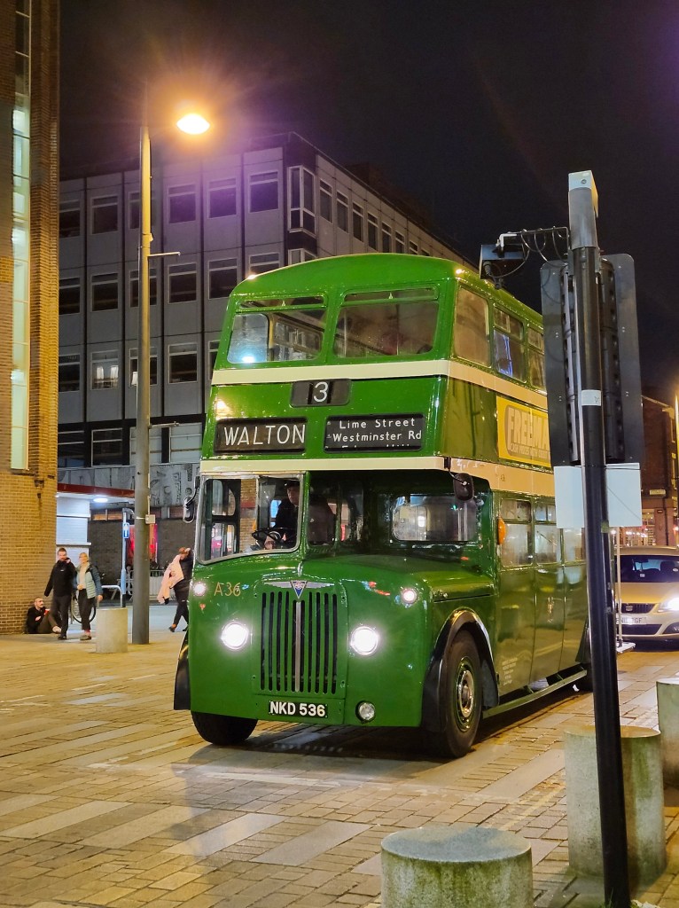 Green vintage double decker bus